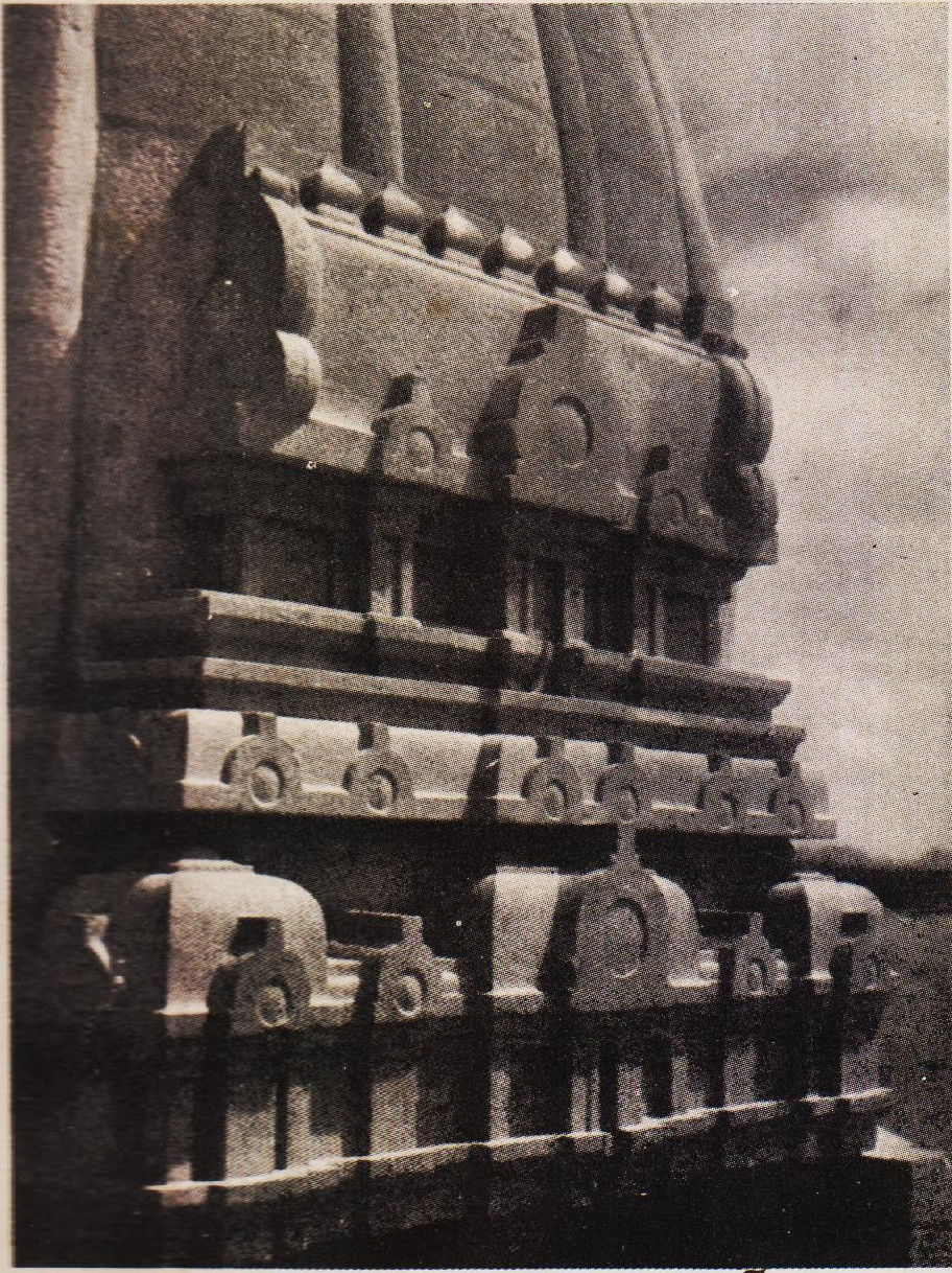 A close view of the Gopuram-design raised in deep relief on four sides of each of the Shikharams